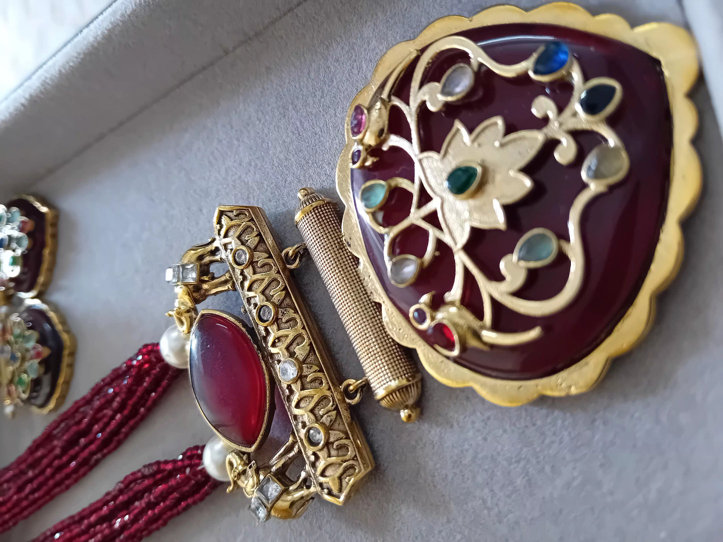 Brass pendant with beaded neckpiece