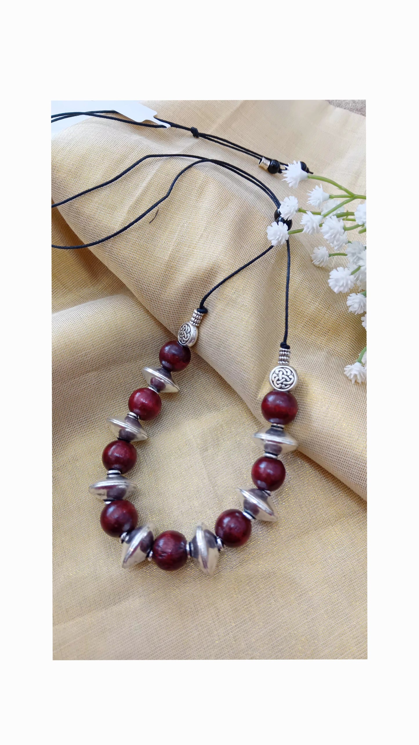 Wooden beads with metal beads.