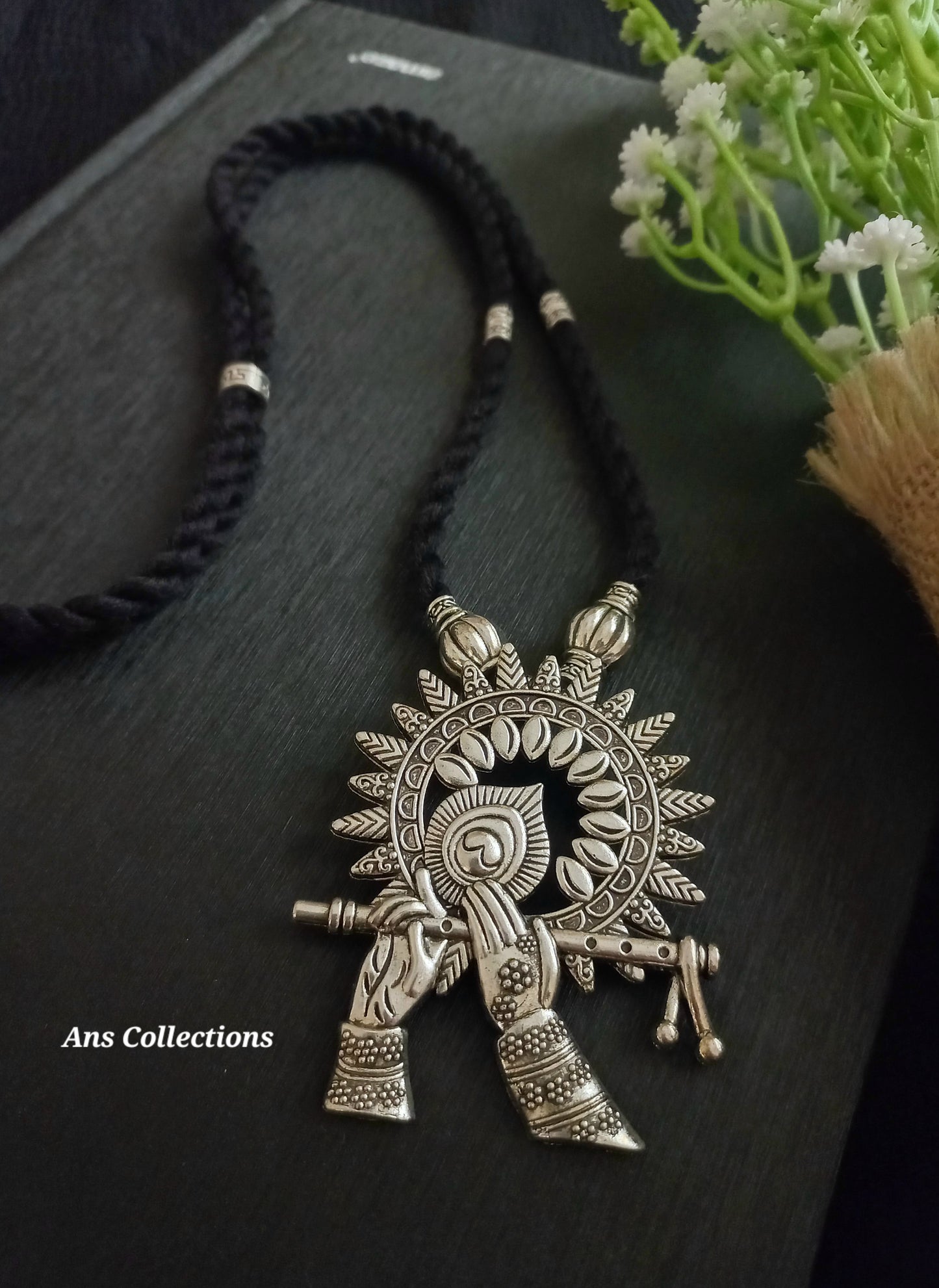 Thread with pendant design