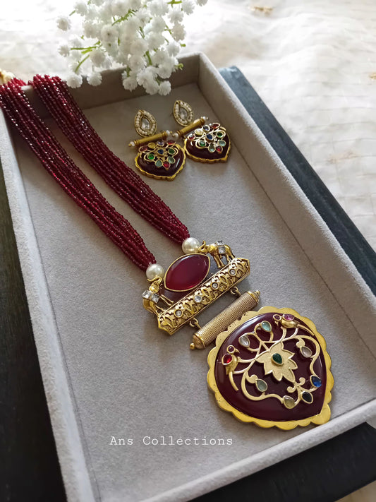 Brass pendant with beaded neckpiece