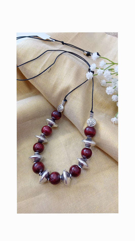 Wooden beads with metal beads.