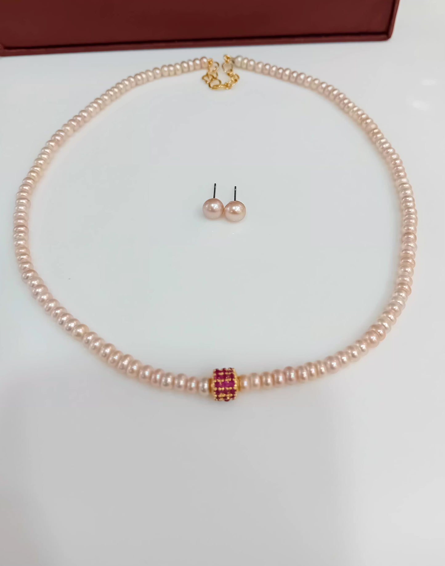 Button shaped pink pearl