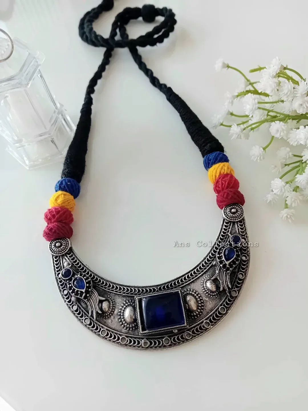 Metal pendant with dori